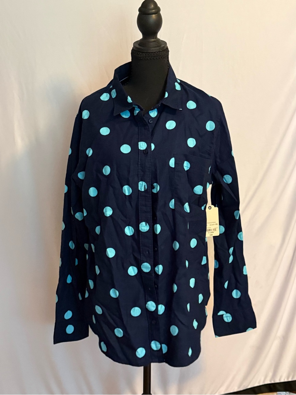 Women’s navy cotton blouse with teal polka dots. New with tags.